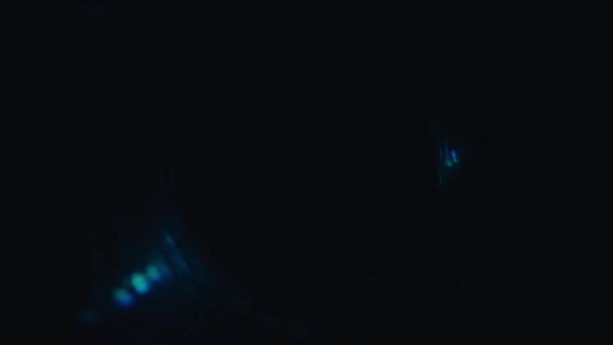 A hypnotic, futuristic animation of a dark, spiraling tunnel lined with glowing cyan lights