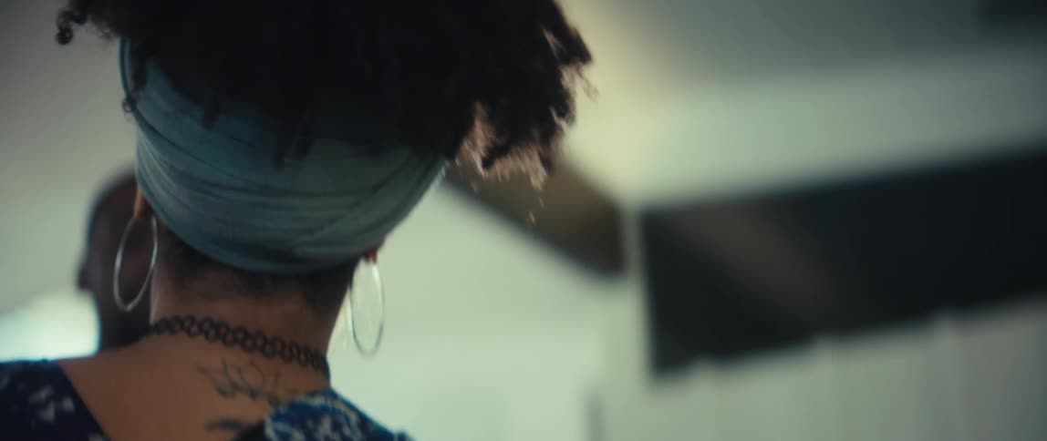 A loving couple shares an intimate and joyful slow dance together in a softly lit room