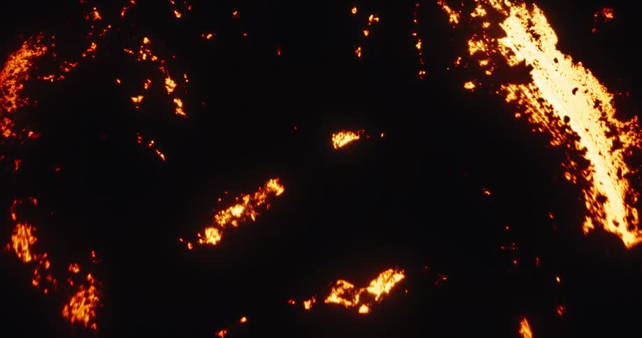 Mesmerizing abstract patterns of glowing hot lava flow and cool against a black background