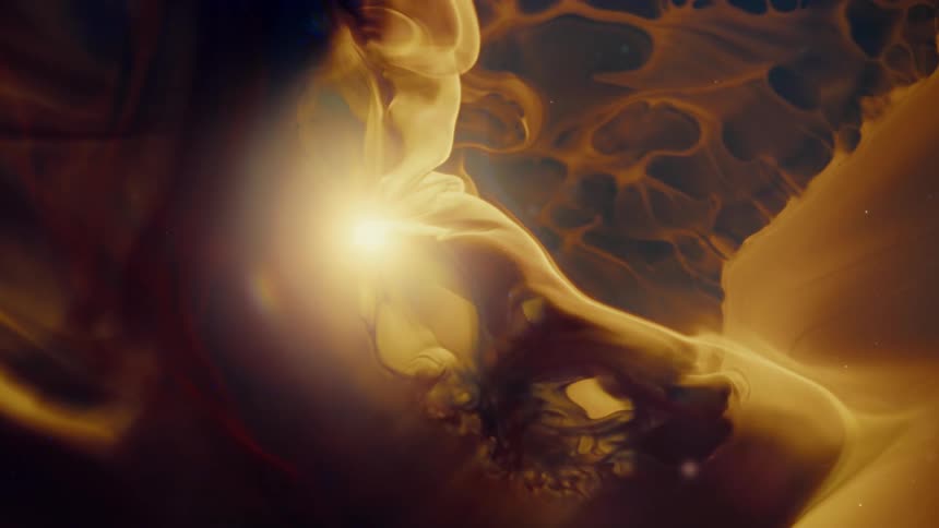 Abstract golden cosmic clouds slowly swirl around a bright, central star in the vastness of space