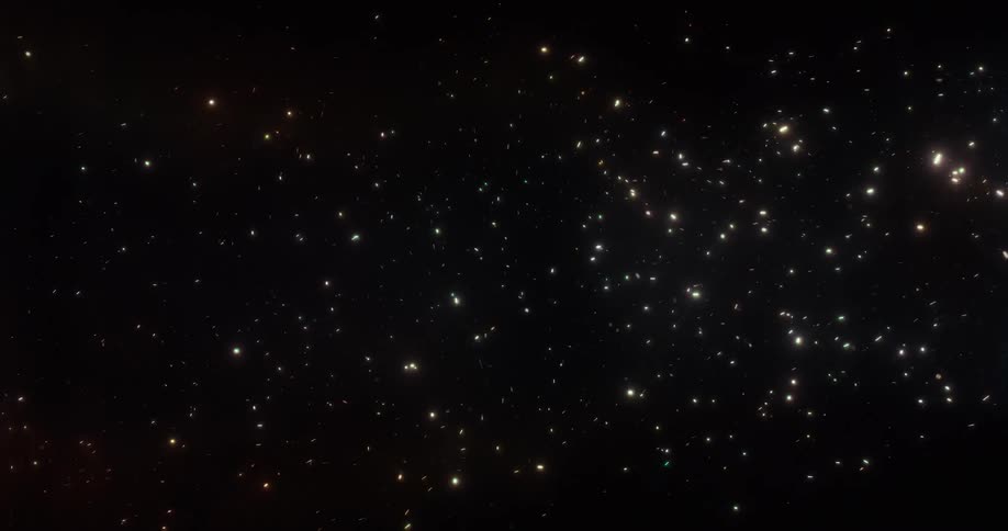 A mesmerizing journey through a dense field of shimmering, colorful stars in the vast darkness of space