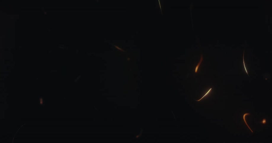 Abstract glowing light streaks and particles dance and swirl energetically against a black background