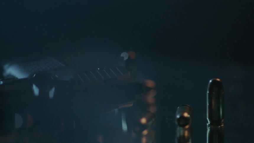 Bullets are lined near a handgun