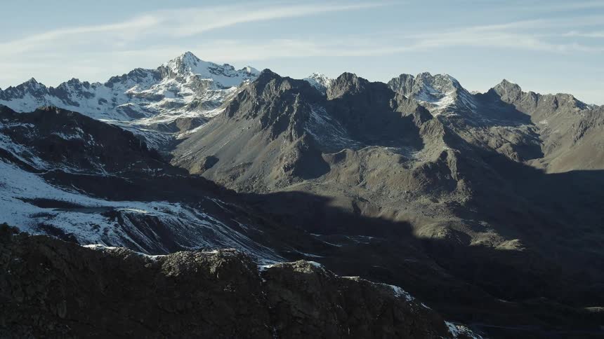 The long range of mountains are covered with snow