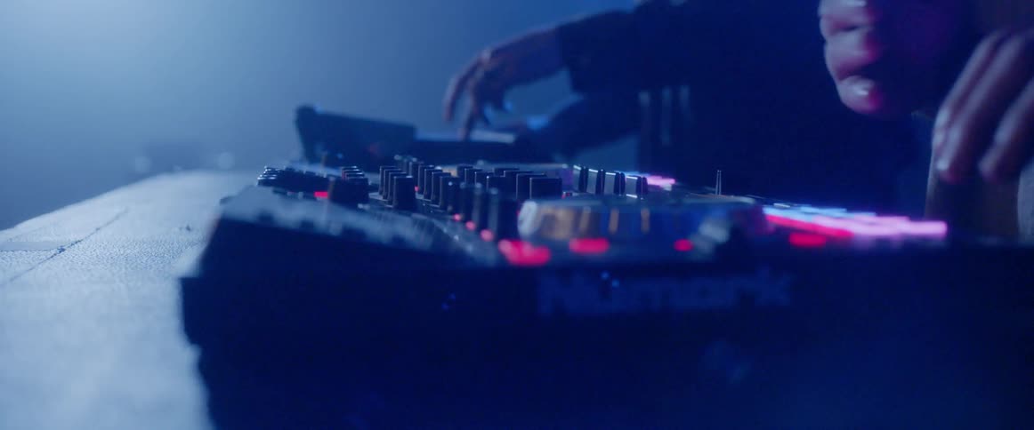Djs adjust a sound machine
