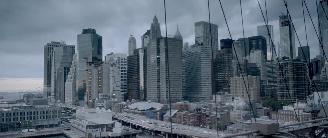 Storm clouds are hovering over a large city