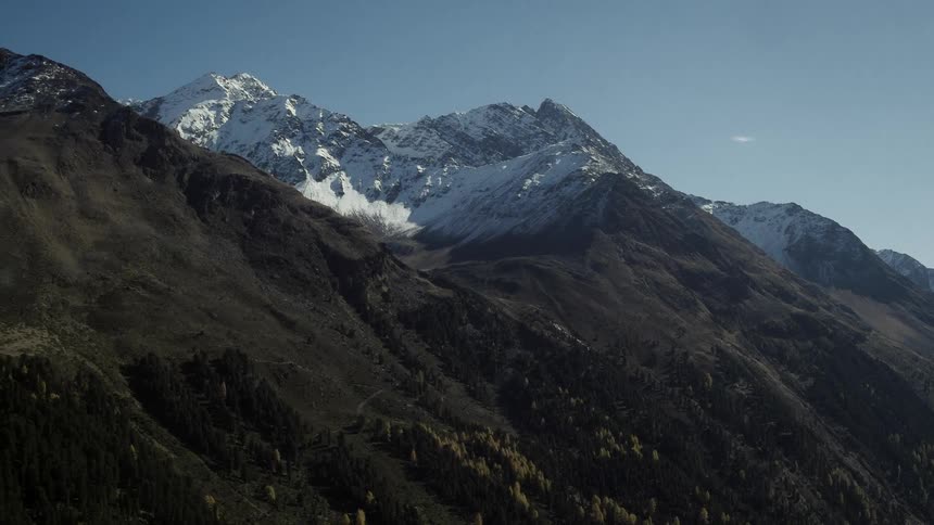 The steep mountain has a lake below