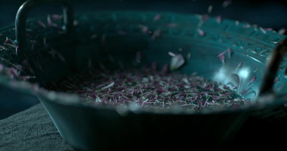 Twigs falling into a bowl