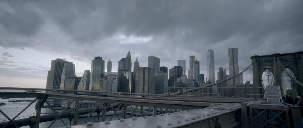 City buildings and skyscrapers are shown on a cloudy day