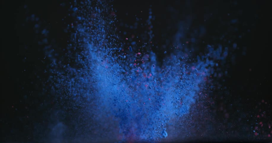 Colored dirt explodes into the sky