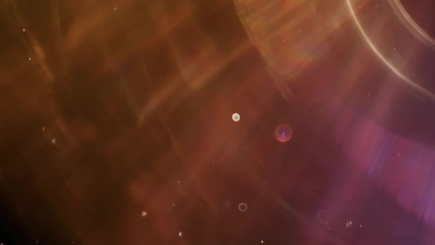 Cosmic bubbles and particles float gracefully through a dark void with colorful, abstract light refractions