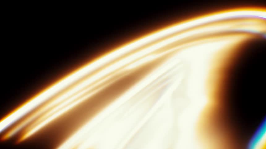 A flowing, ethereal arch of golden light with prismatic rainbow edges shifts and moves on a black background