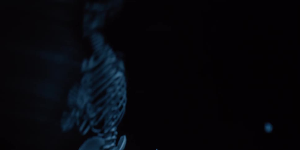 Chaotic, blurry, and spooky shots of a human skeleton model dancing in the dark with a strobing light effect