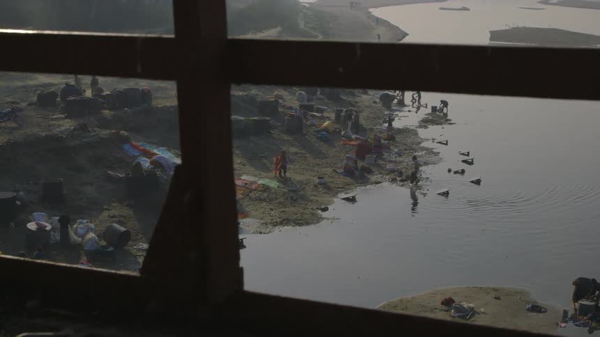 View from a window of people by the water