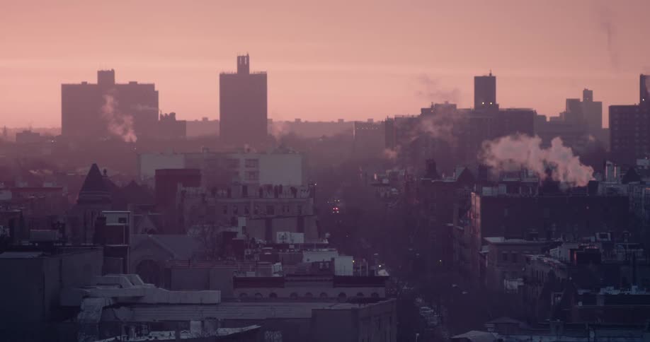 View of top of buildings at sunset