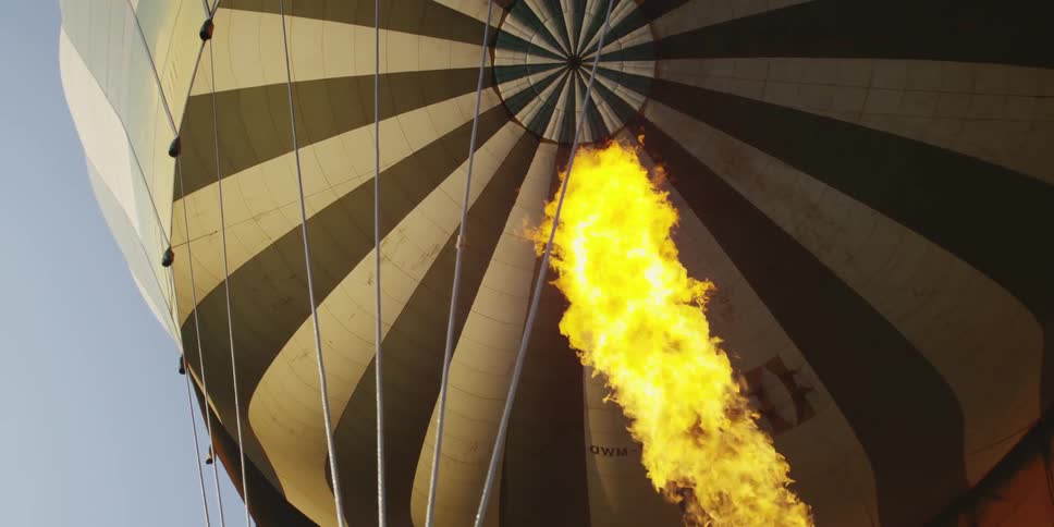A flame flares up inside a hot air balloon
