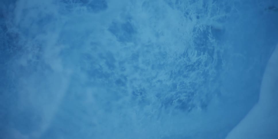 Ethereal blue abstract background featuring slow-moving, cloudy formations