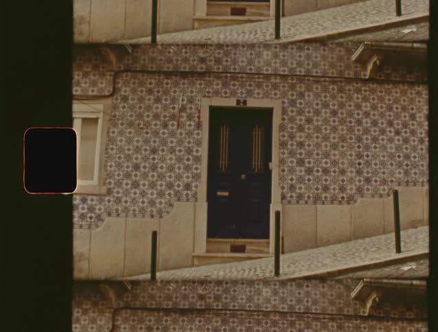 Vintage film shot of a traditional Portuguese building facade with azulejo tiles in a repeating mirror effect