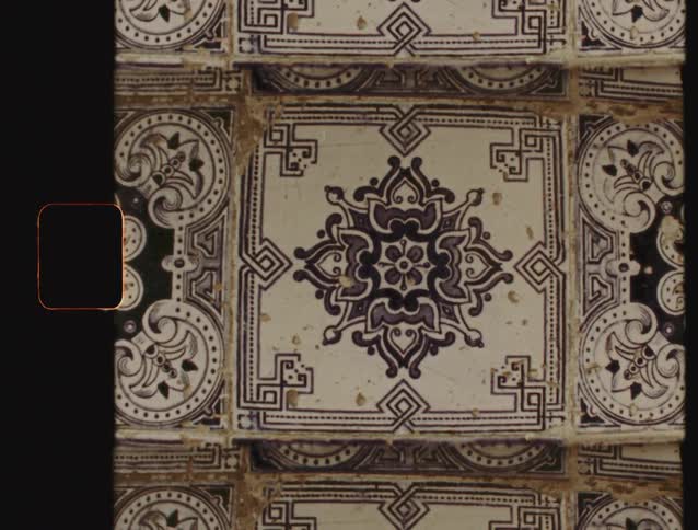 Vintage Super 8mm film footage captures the intricate, symmetrical pattern of a traditional Portuguese azulejo tile