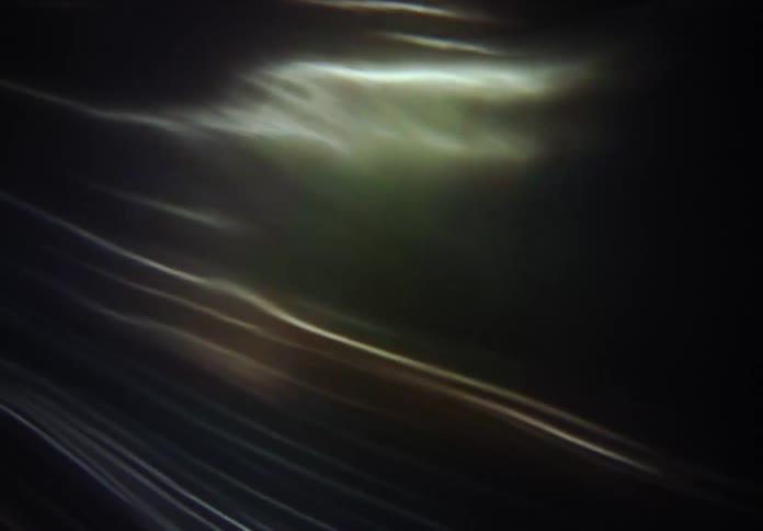 A mesmerizing background of flowing golden and white light waves and caustics