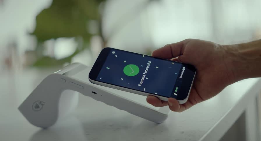 An abstract and disorienting view of a successful contactless payment made with a smartphone