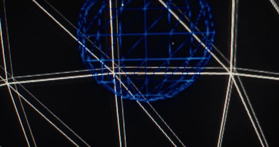 A vintage 1970s computer-generated animation of a rotating wireframe globe on a black screen