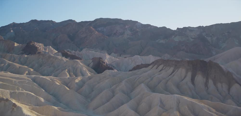 A stunning view of the intricately eroded badlands and colorful mountains of Zabriskie Point in Death Valley