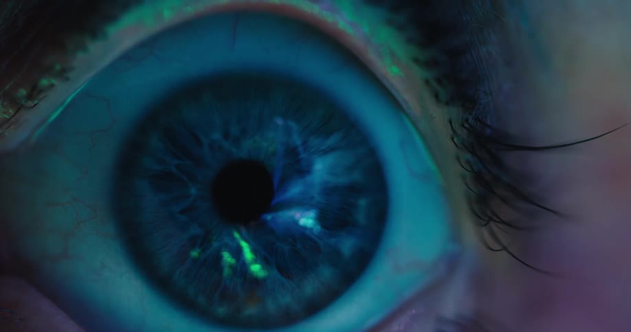 A detailed macro shot shows a blue iris as abstract, futuristic light scans across its surface, creating a technological effect