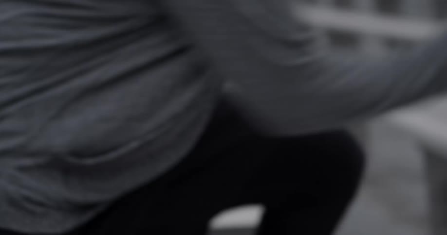 A man runs up some bleachers
