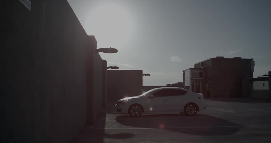 Car parked on top of a parking ramp