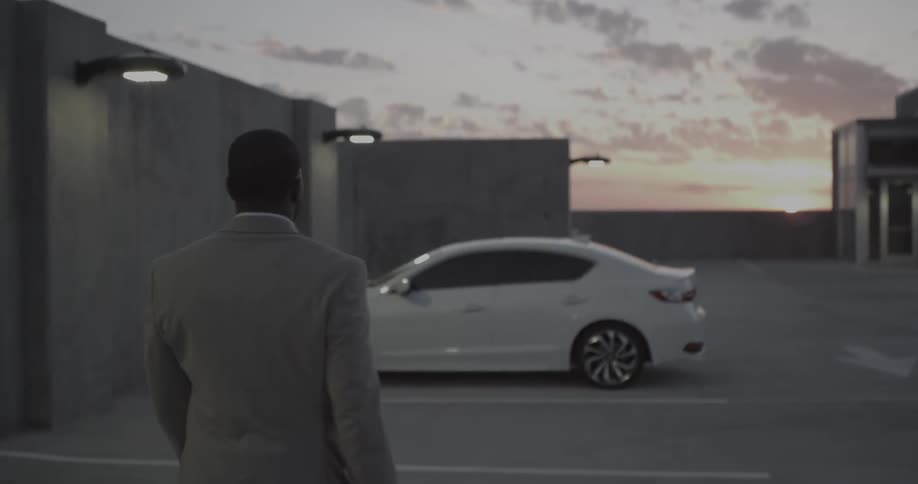 A man walks over to his car