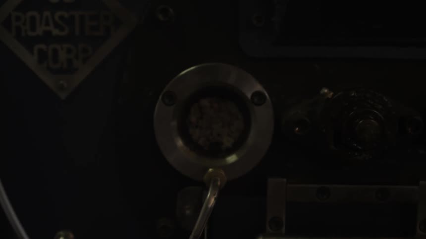 Coffee beans spinning around inside a machine