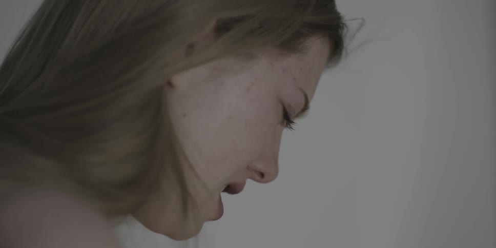 A woman in a room is crying