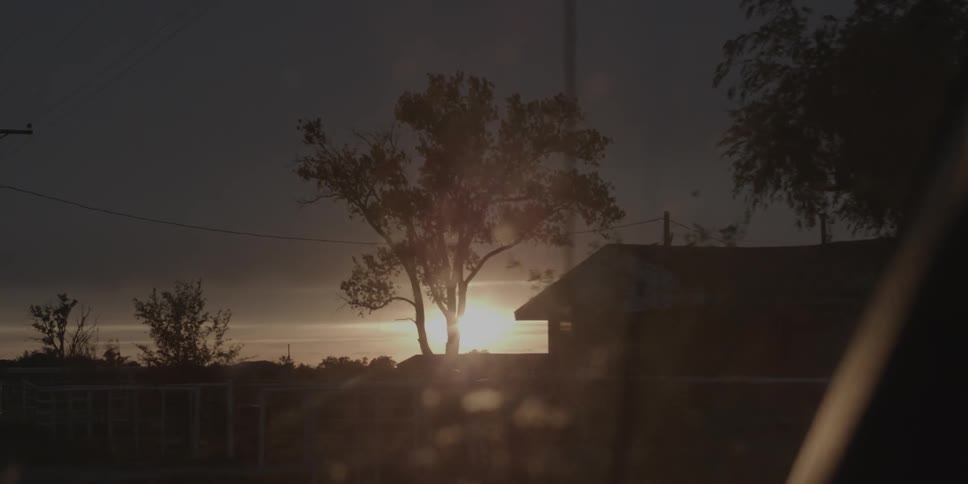 Sunset on a cloudy evening over neighborhood