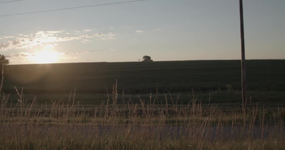 Sun setting behind the horizon out in the country