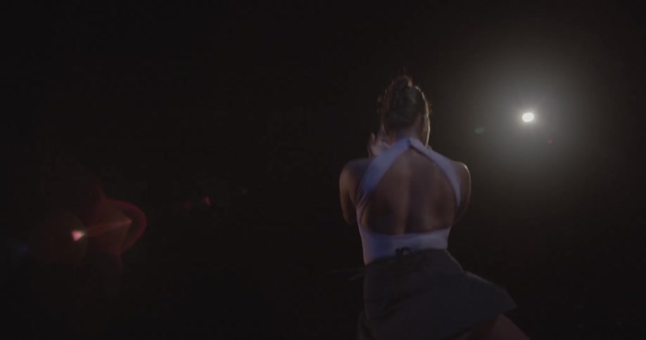 A ballerina is performing onstage