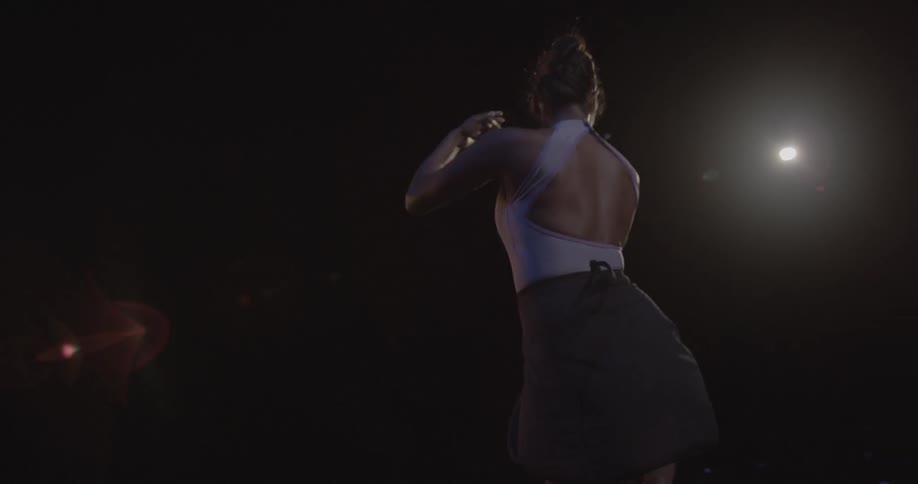 A ballerina pirouettes on stage