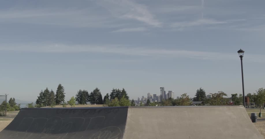 A skate park is empty on a sunny day