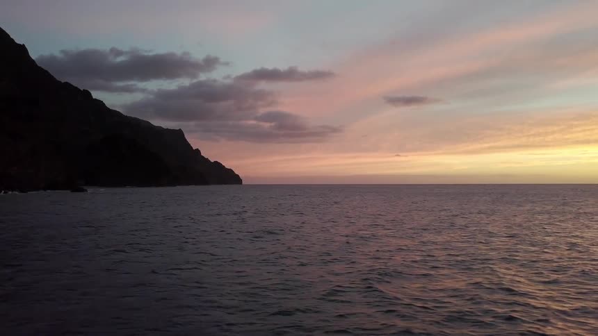 Sunset overlooking the ocean and a cliffside