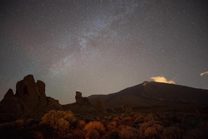 A breathtaking timelapse of the Milky Way galaxy moving across the night sky above the volcanic landscape of Mount Teide