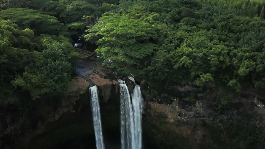 Waterfalls cascade over a cliff
