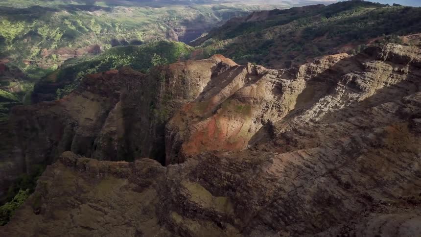 A rocky, rolling valley during the day
