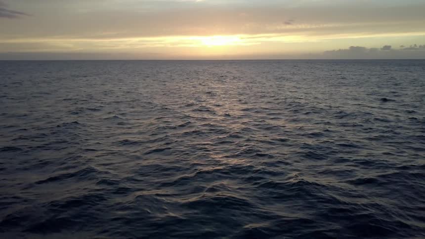 Rippling waves on the ocean during the sunset