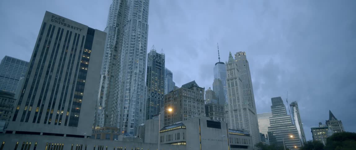 Tall city buildings on a cloudy evening