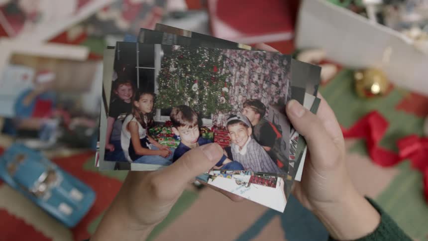 A person looking through old photographs