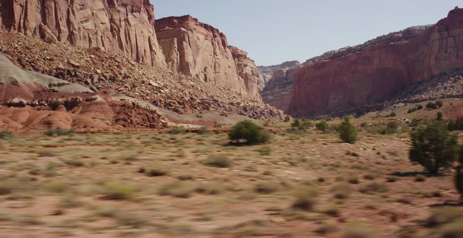 A scenic drive through the majestic red rock cliffs and desert landscape of Capitol Reef National Park, Utah
