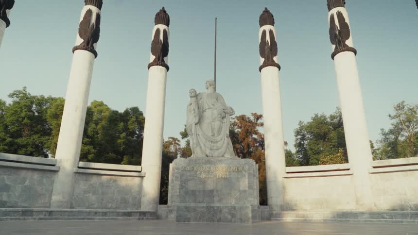 A low-angle, slow pullback of the majestic Altar to the Homeland monument, also known as the Monument to the Boy Heroes, in Mexico City