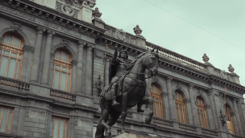 Slow zoom on the majestic equestrian statue known as El Caballito in front of the National Museum of Art in Mexico City