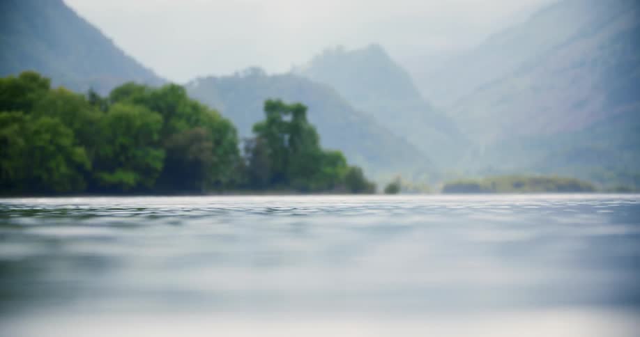 Water is flowing in a lake in a natural setting during the day