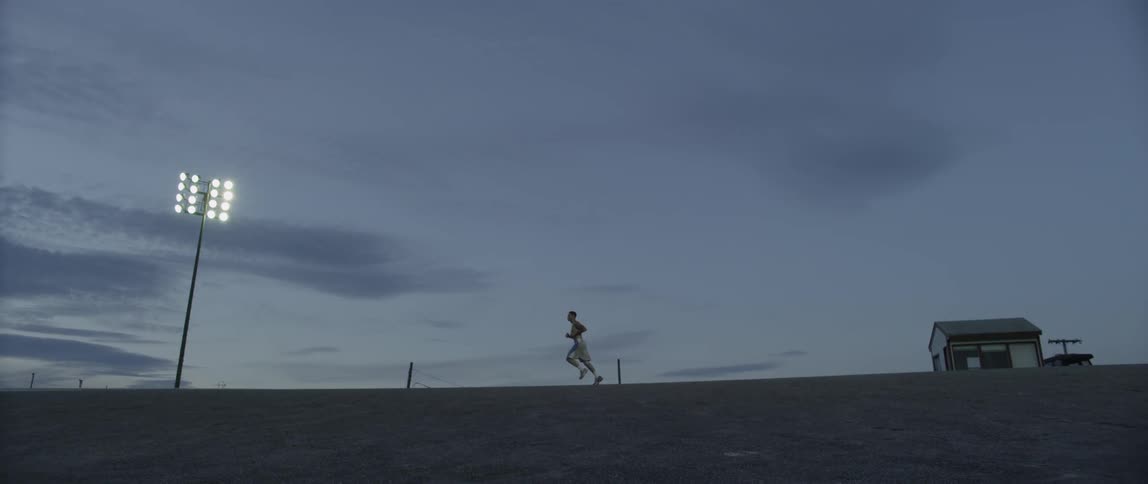 Man running across a field